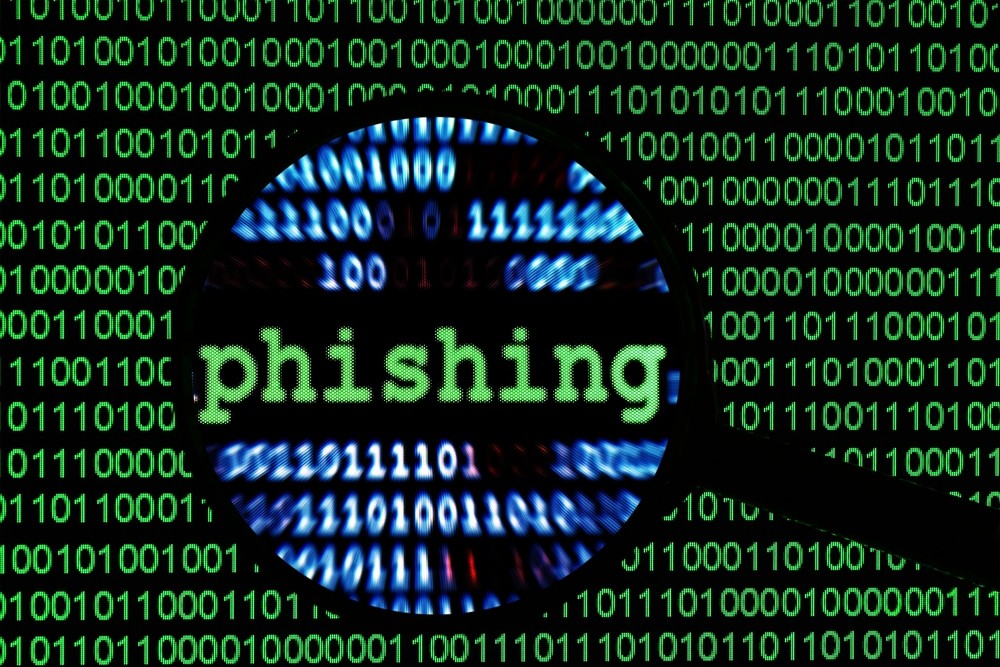 An image titled 'Phishing' with green lines of code in the background